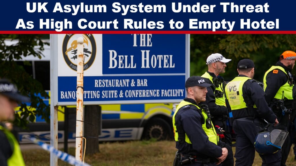 Police officers in high-visibility jackets stand outside The Bell Hotel in Essex, the site of protests and a court ruling on housing asylum seekers.