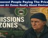 driving out the poor dirty truth behind uk emission zones - The Expose A digital illustration titled “EMISSIONS ZONES” features a distressed elderly man wearing a navy beanie and jacket, standing beside a smoking, old green car entering a designated clean air zone. Surrounding him are symbolic signs: a green “CLEAN ZONE” badge, a yellow “PENALTY CHARGE” notice, and a glowing gold coin with a pound symbol, highlighting the financial burden. The scene has a muted, somber tone with dark smog in the background, conveying themes of economic hardship and environmental enforcement.