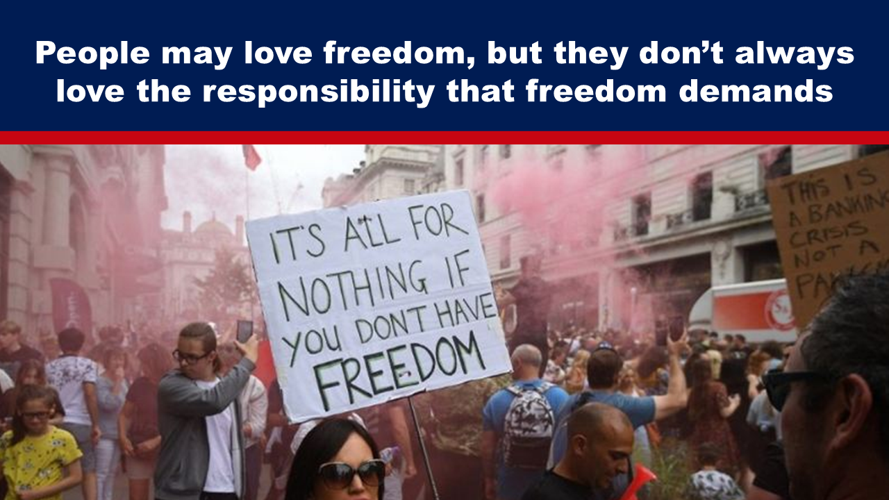 Expose News: Crowd rallying in the streets with signs demanding freedom amidst colorful smoke. Freedom attracts, but responsibility follows.