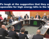 Expose News: MPs in lively debate, chuckling at claims of blame for UK's high energy bills, captured in a lively parliamentary scene.