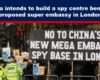 Expose News: Crowd protesting in London against China’s proposed super embassy and alleged spy centre plans, voicing concerns and holding signs.