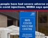 Blue headline banner reads: '1 in 7 people have had severe adverse events from covid injections, MHRA says quietly,' above a scene with an NHS COVID Vaccine Centre sign.