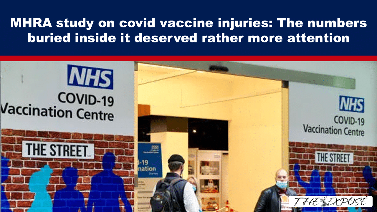 Editorial image: an NHS COVID-19 Vaccination Centre entrance with people wearing masks, accompanying a story about MHRA vaccine injury numbers.