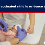 Healthcare worker in purple gloves gives a child a shot in the thigh while the child sits on a table; banner above reads 'Every unvaccinated child is evidence of a crime'.