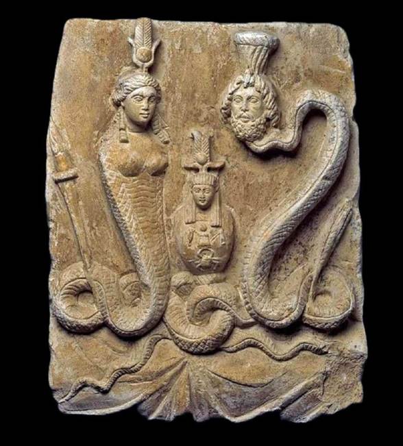 Ancient stone relief showing an Egyptian goddess and a bearded man, with a large snake coiling around them and a small central figure between them.