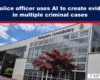 Photo of a Derbyshire Constabulary building with large glass front and a red tree in front, under a blue sky.