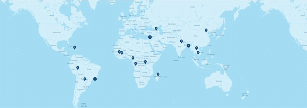 image - The Expose World map with multiple blue pin markers indicating locations worldwide