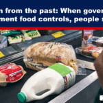 Bold headline banner about governments' food controls causing starvation over a grocery checkout scene with bread, milk, and eggs visible